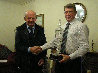 Photo of David Jane receiving the Rouge Sheep Society Show Flock Award from Chairman John Smithson