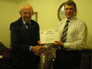 Photo of David Jane receiving his award from Chairman John Smithson.